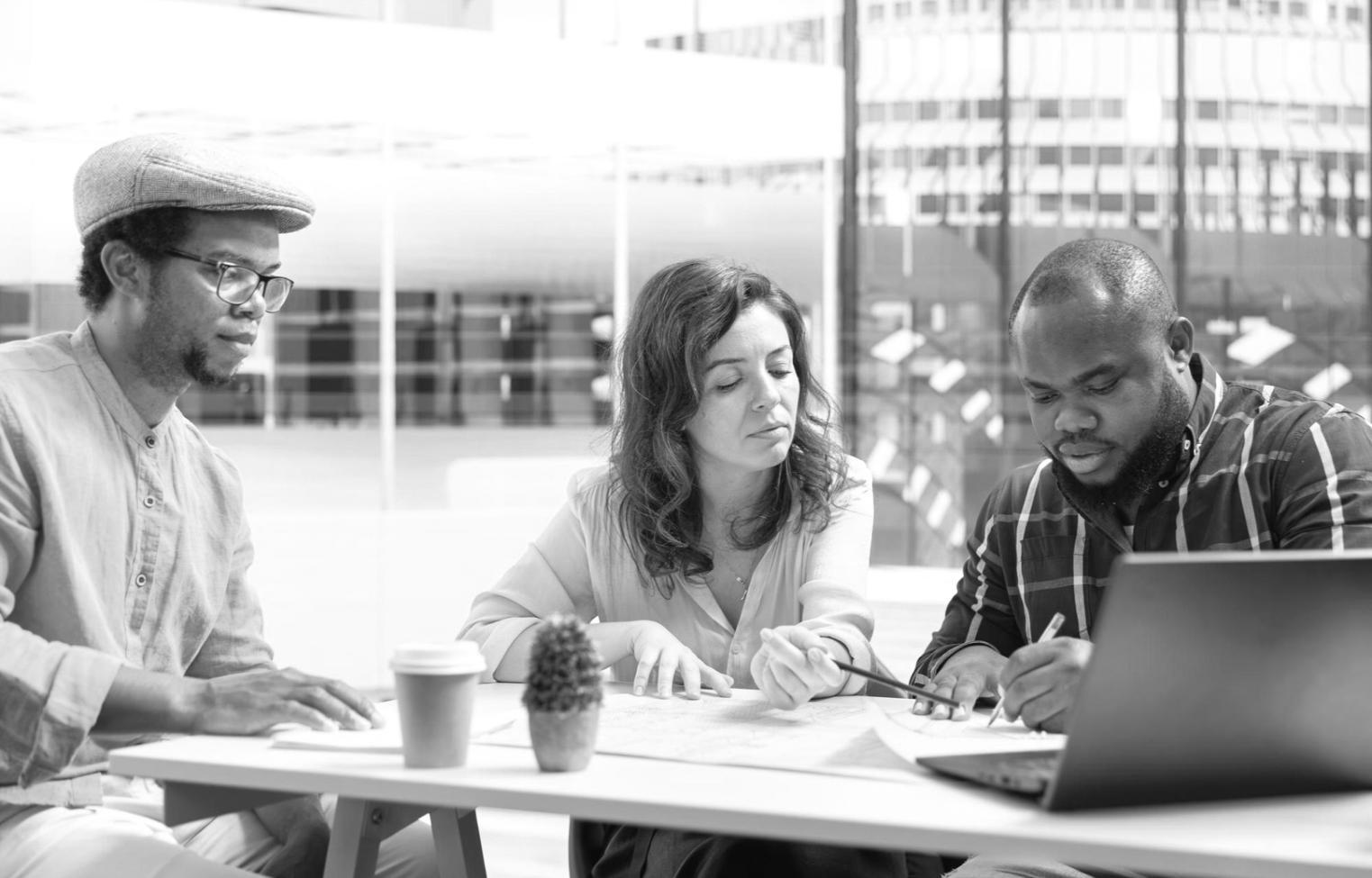 Students reviewing financial documents together in study environment