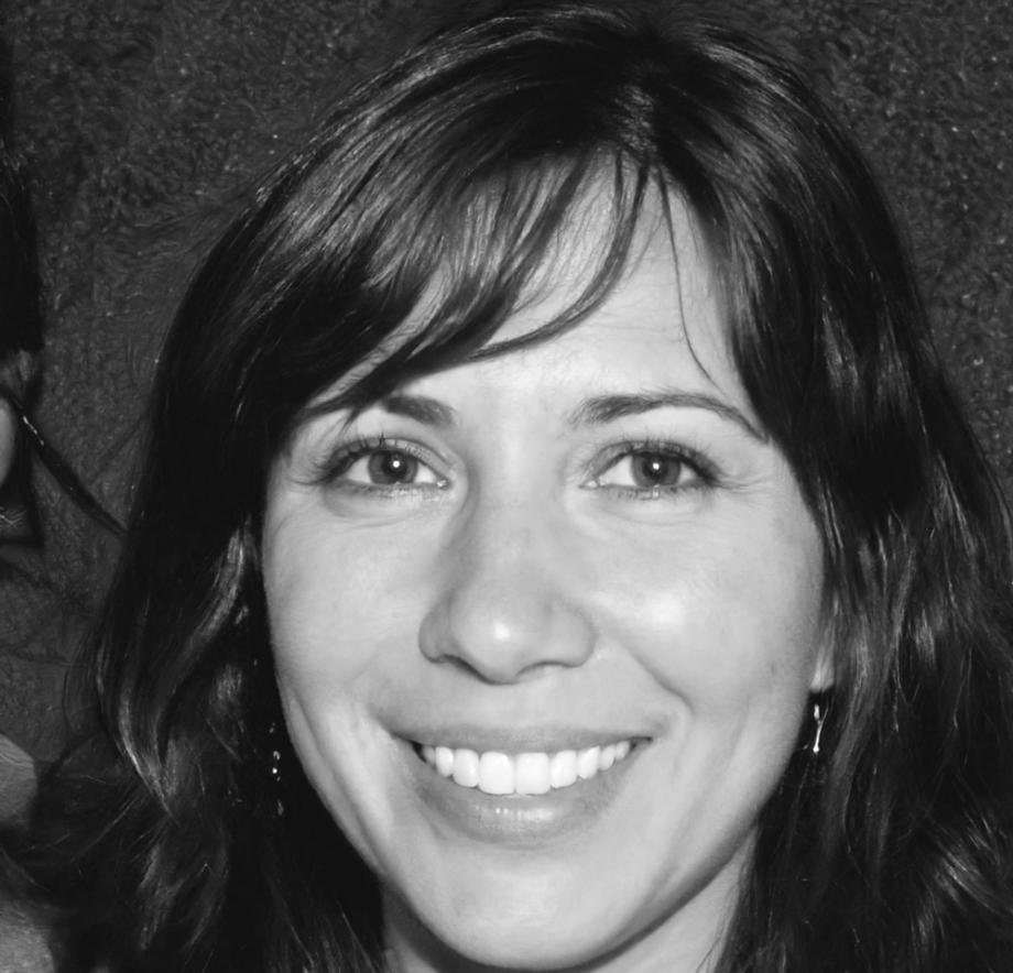 Business professional reviewing financial reports with confidence